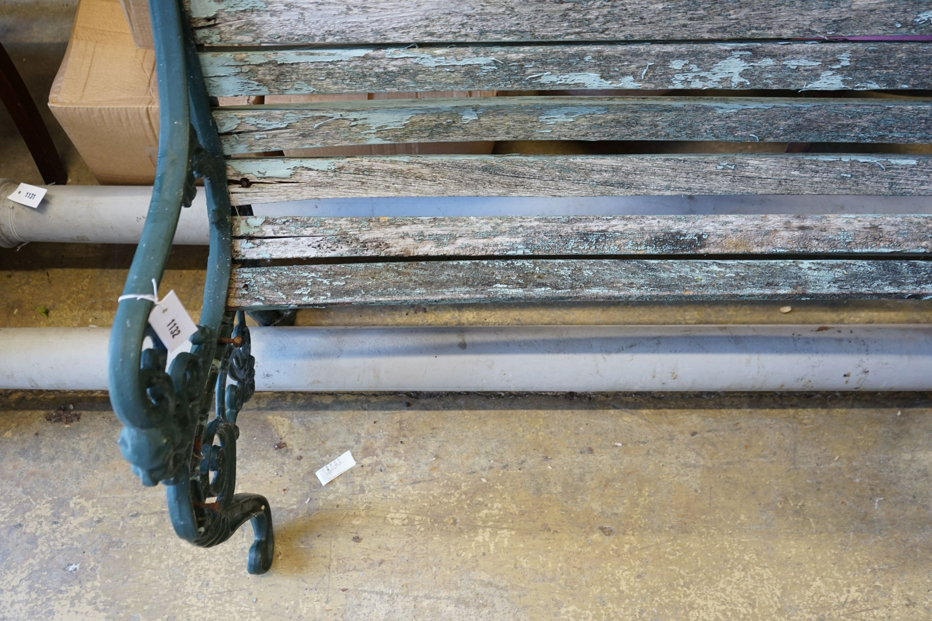 A painted aluminium slatted garden bench, in need of restoration, width 125cm